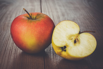 fresh red apples on the wooden table