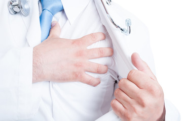 Close-up of medic or doctor grabbing chest like heart attack