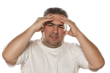 Naklejka premium tired man having a strong headache