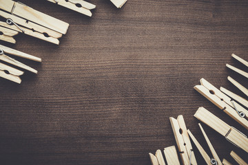 wooden clothes pegs on the brown table