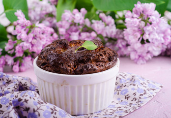 Homemade chocolate cheese souffle on pink background