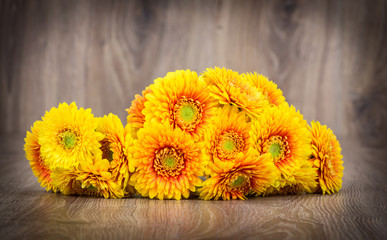 Bouquet of gerber flowers on wooden background
