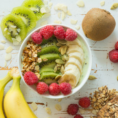 Smoothie in a bowl with fruits and seeds