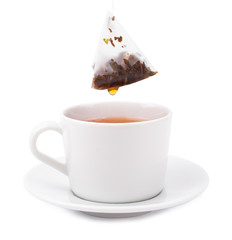 Tea bag in a white cup on a