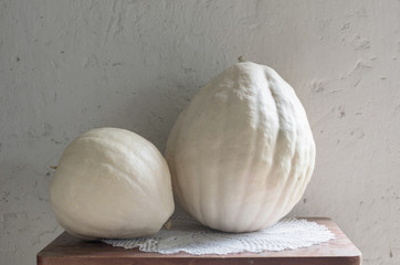 white pumpkins on old table
