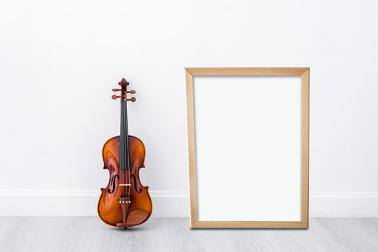 Mock up blank wooden frame board with Classical cello on white w