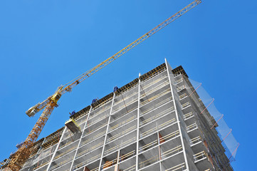 Crane and highrise construction site