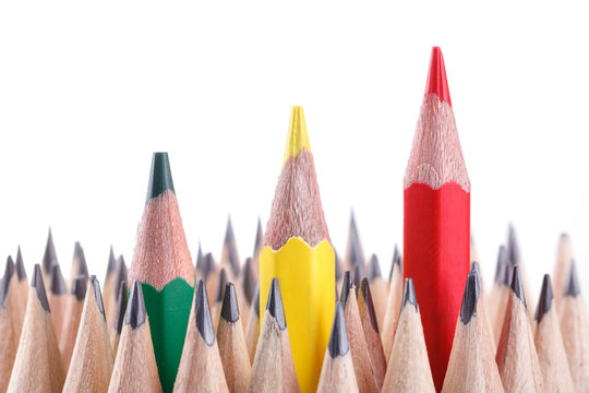 three sharpened green,yellow,red pencil among many ones