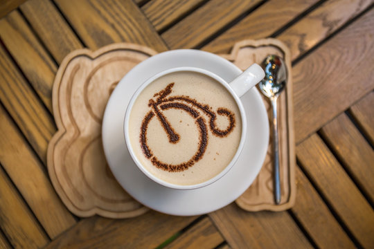Сup of coffee with bicycle picture