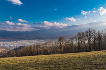 Summer landscape with sunrise and the dark blue sky in mountains