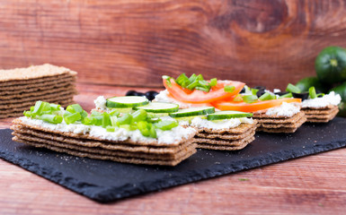 small loafs with cheese and vegetables