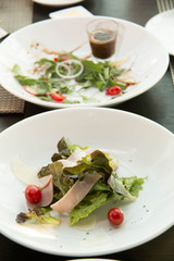  ham and cheese with salad on white plate