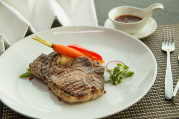  pork chop on a white plate