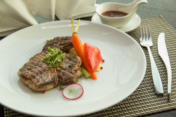 pork chop on a white plate