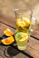 Fototapeta na wymiar home orange lemonade with mint