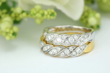 diamond wedding ring on flower background