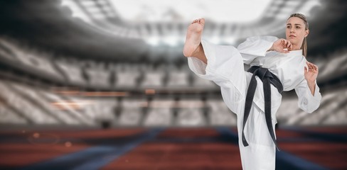 Fototapeta na wymiar Composite image of female athlete practicing judo