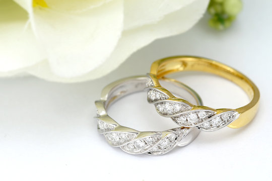 diamond wedding ring on flower background