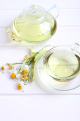 teapot and cup herbal tea wood background
