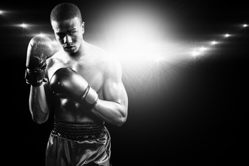Fototapeta na wymiar Composite image of portrait of boxer performing uppercut