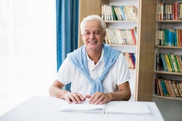 Senior man using braille to read
