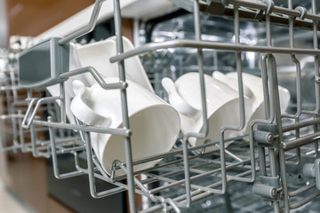 Fototapeta na wymiar Dishes in dishwasher machine