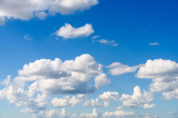 Naklejka na ściany i meble White Cumulus Clouds On Blue Sky