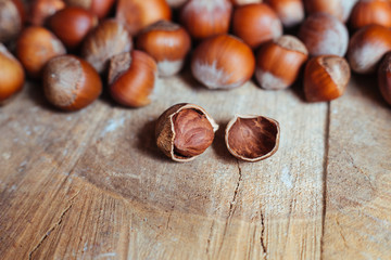 Fototapeta premium Hazelnuts on rustic background