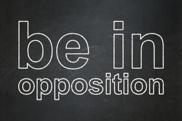 Fototapeta premium Politics concept: Be in Opposition on chalkboard background