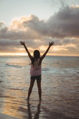 Fototapeta premium Beautiful woman standing on the beach