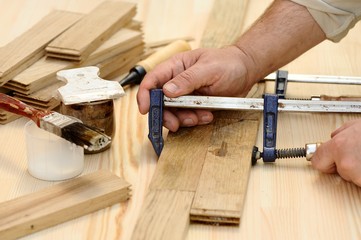 Carpenter hands working with wooden planks