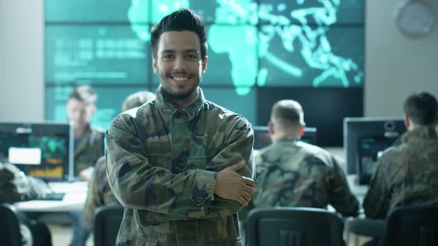 Portrait of Officer in Uniform in Monitoring Room filled with Displays on Military Base. Shot on RED Cinema Camera in 4K (UHD).