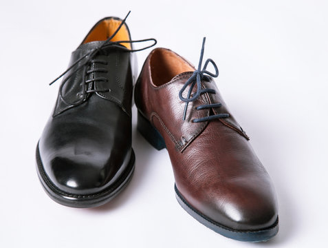 Two diverse male and female leather shoes