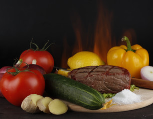 beef with vegetables on wooden background