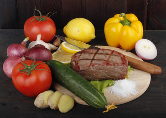 beef with vegetables on wooden background