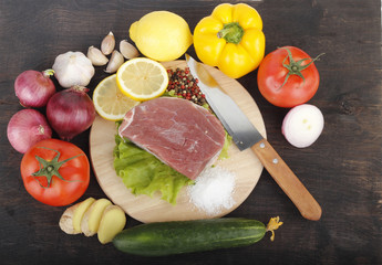 beef with vegetables on wooden background