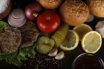 hamburger ingredients on wooden background