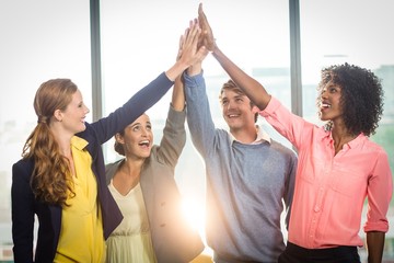 Business people giving high five to each other 