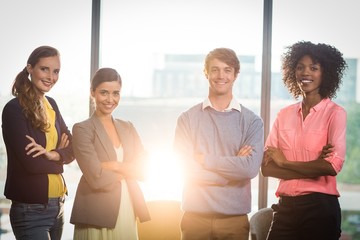 Fototapeta premium Portrait of business people standing with arms crossed