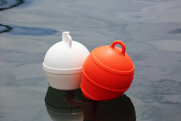 Obraz premium Orange And White Buoys