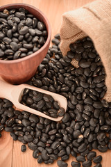 Vigna mungo or black beans with wooden scoop
