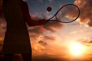 Composite image of athlete playing tennis with a racket 