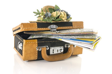 suitcase with maps for travel destinations