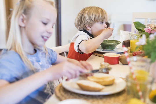 Boy and girl having breakfast