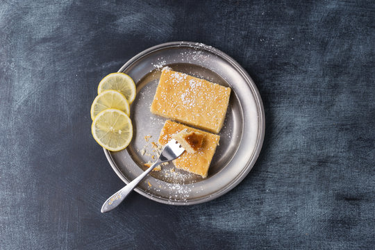Lemon cake with icing sugar on plate