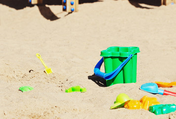 Fototapeta na wymiar Children's toys in the sandbox