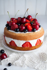 Strawberry cake homemade gourmet sweet dessert bakery food decorated with berries and whipped cream on white background table