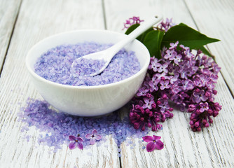 Fototapeta na wymiar Lilac flowers with sea salt
