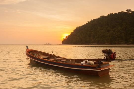 Beautiful sunset with little boat at  Payam Island ,Thailand