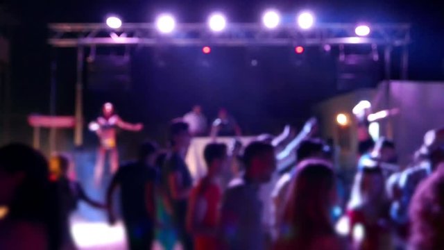 Celebration, holiday, feast. Night Beach Disco Go-go with illumination, concert near sea. Dancing people with fun gladness on the discotheque entertainment. Gaiety merriment joyfulness of teens